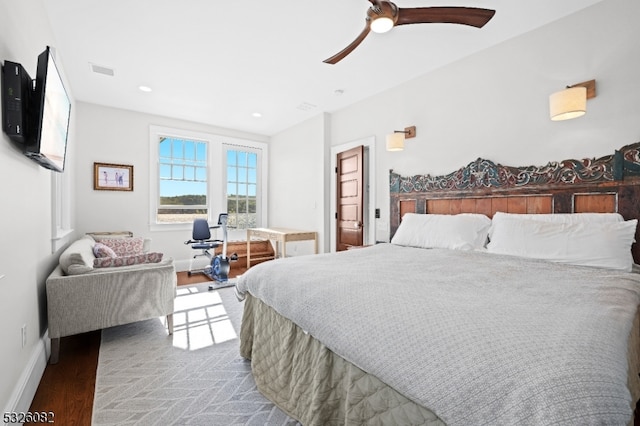 bedroom featuring ceiling fan and dark hardwood / wood-style flooring