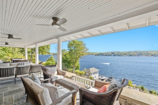 view of patio featuring an outdoor hangout area, a water view, and ceiling fan