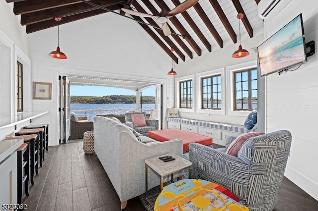 sunroom featuring vaulted ceiling with beams