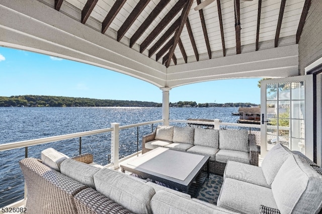 view of patio / terrace with a water view and a balcony