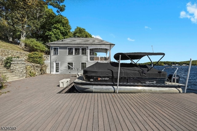 exterior space featuring a water view and a balcony