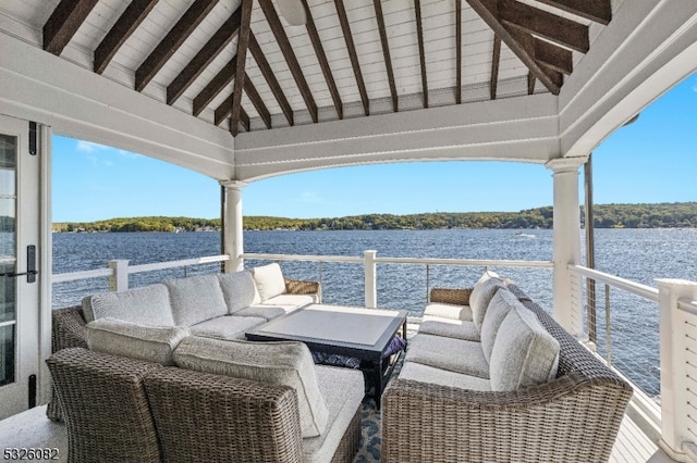 view of dock with a water view and a balcony