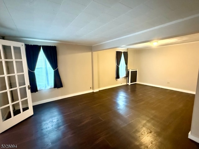 basement with dark hardwood / wood-style flooring