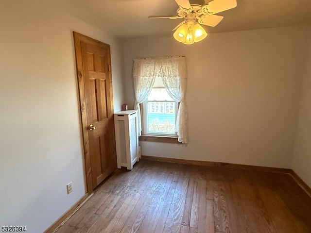 spare room featuring ceiling fan and light hardwood / wood-style floors