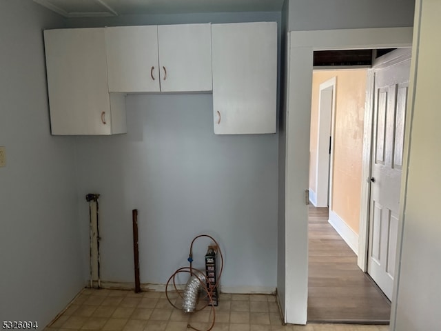 kitchen with white cabinetry and light wood-type flooring