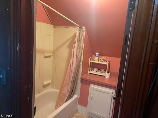 bathroom with shower / bath combination with curtain