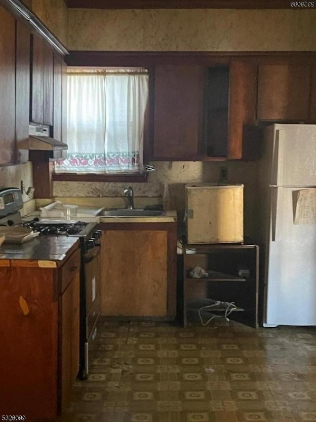 kitchen with white appliances and sink