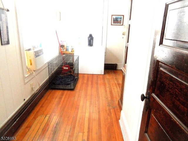 hallway featuring hardwood / wood-style floors and cooling unit