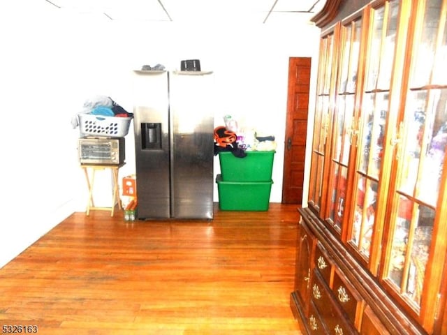 corridor with hardwood / wood-style floors