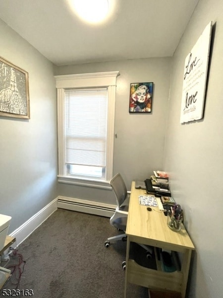 home office featuring a baseboard radiator and dark carpet