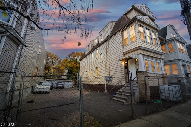 view of property exterior at dusk