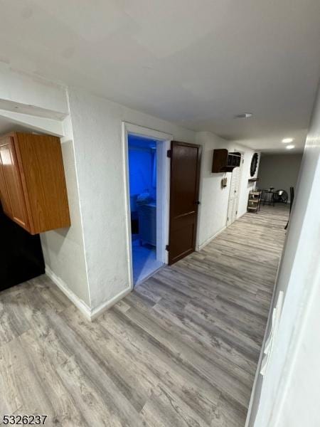 corridor featuring light hardwood / wood-style floors