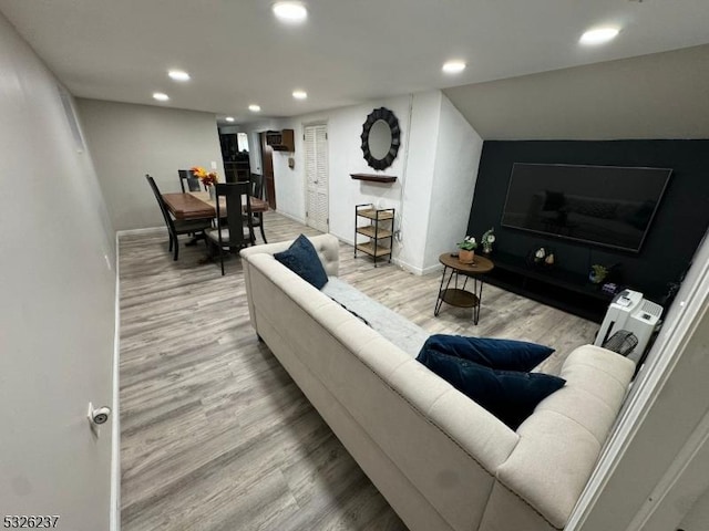 living room with light hardwood / wood-style flooring