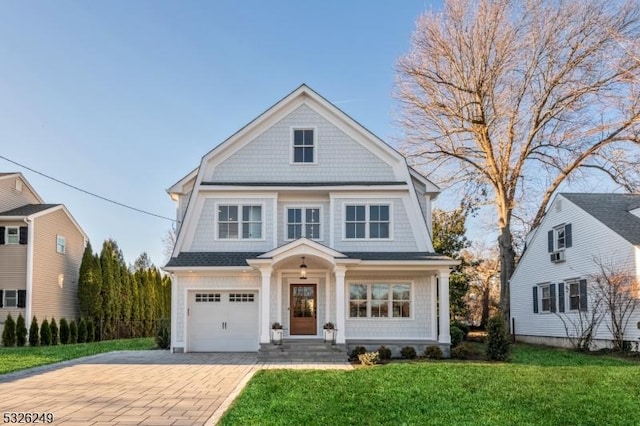 view of front of house with a garage and a front yard