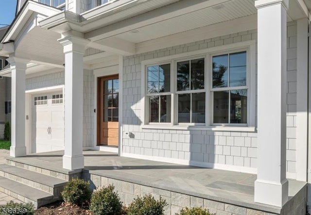 doorway to property featuring covered porch