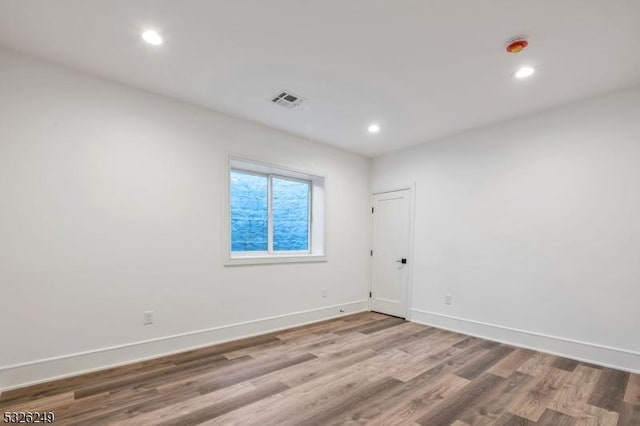 spare room featuring hardwood / wood-style flooring