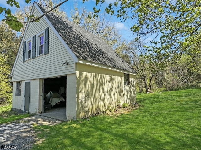 garage featuring a yard