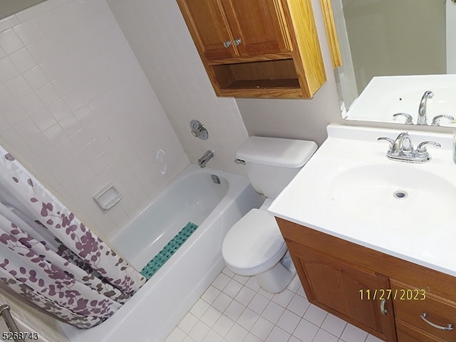 bathroom with tile patterned floors, vanity, and toilet