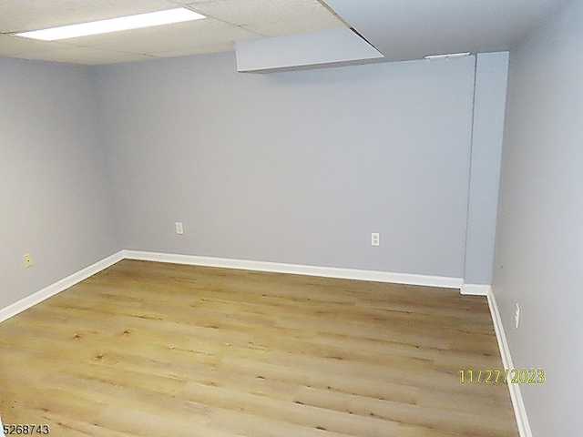 unfurnished room with hardwood / wood-style floors