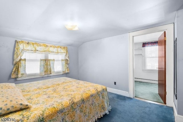 carpeted bedroom featuring a closet and a baseboard radiator