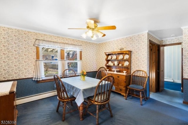 carpeted dining space with baseboard heating, ornamental molding, and ceiling fan