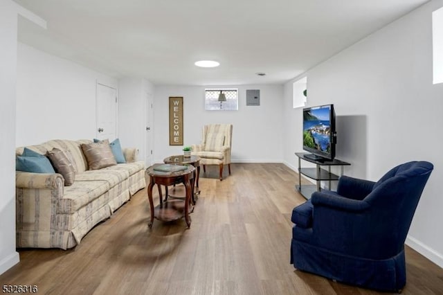 living room featuring baseboards and wood finished floors