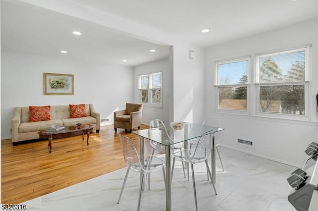 dining area featuring marble finish floor, baseboards, visible vents, and recessed lighting