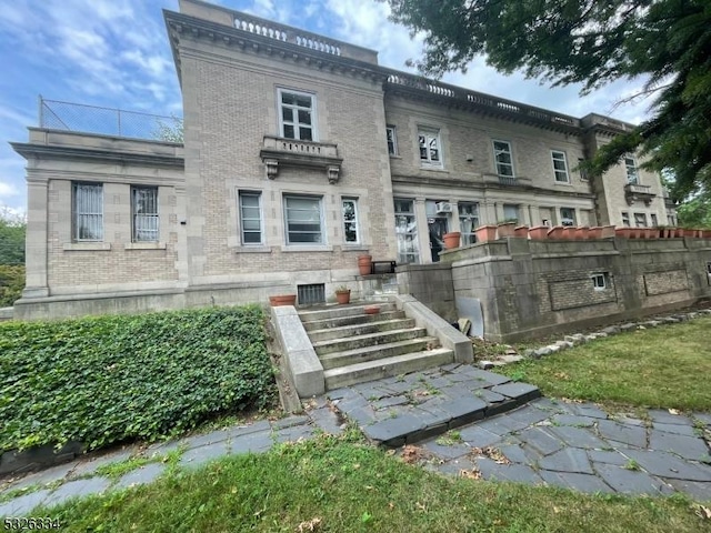 rear view of property with a balcony