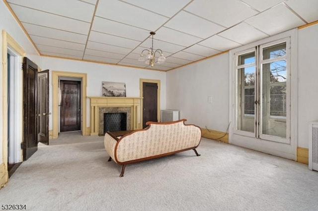 living room with a notable chandelier and light colored carpet