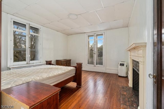 bedroom with dark wood-type flooring