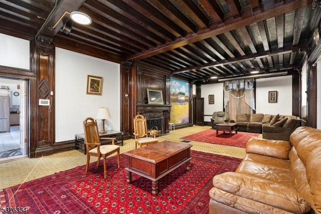 living room with carpet flooring and beam ceiling