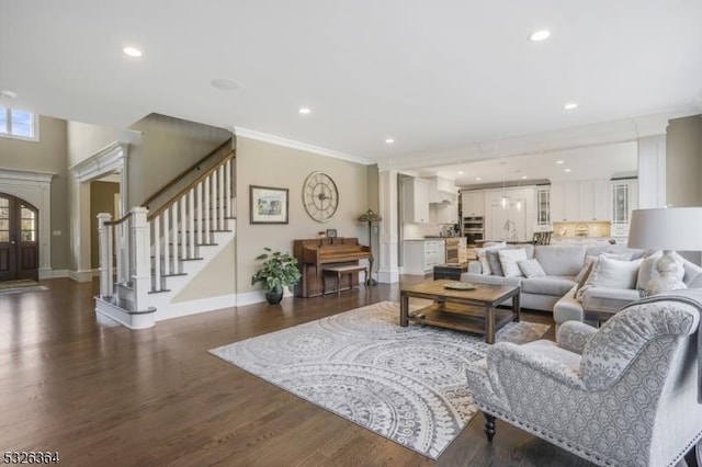 living room featuring crown molding, dark wood-type flooring, and french doors