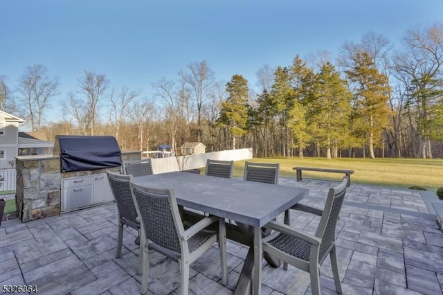 view of patio with an outdoor kitchen and area for grilling