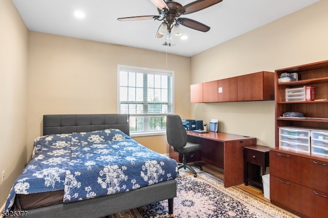 bedroom featuring light hardwood / wood-style flooring and ceiling fan