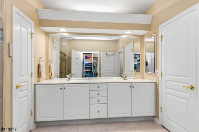 bathroom with tile patterned floors, vanity, and ornamental molding