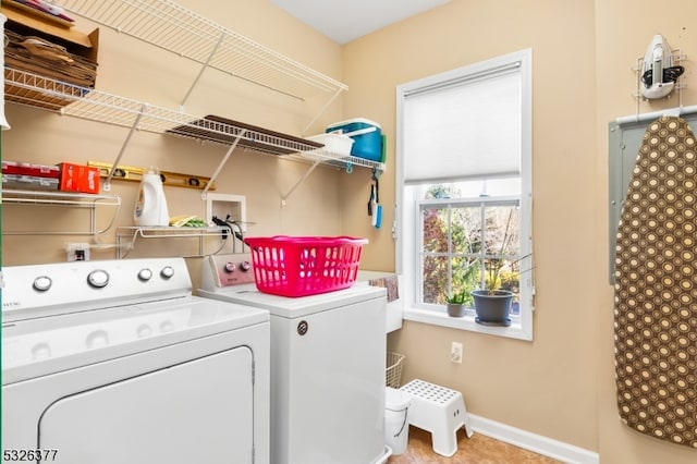 laundry area with independent washer and dryer