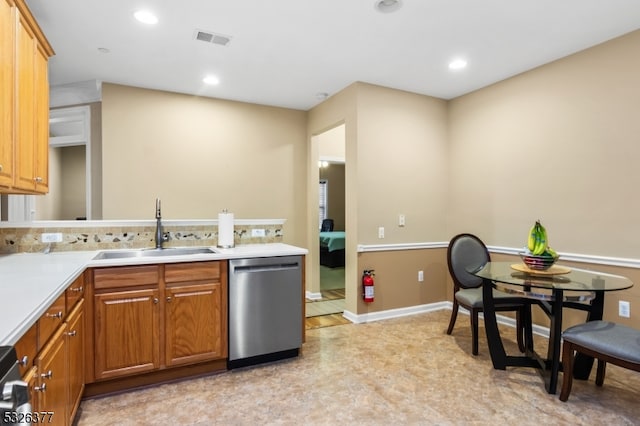 kitchen featuring stainless steel dishwasher and sink