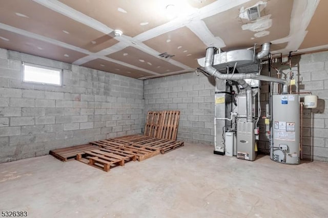 basement featuring heating unit, visible vents, gas water heater, and concrete block wall