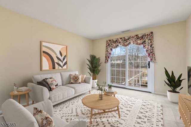 carpeted living room with baseboards and visible vents