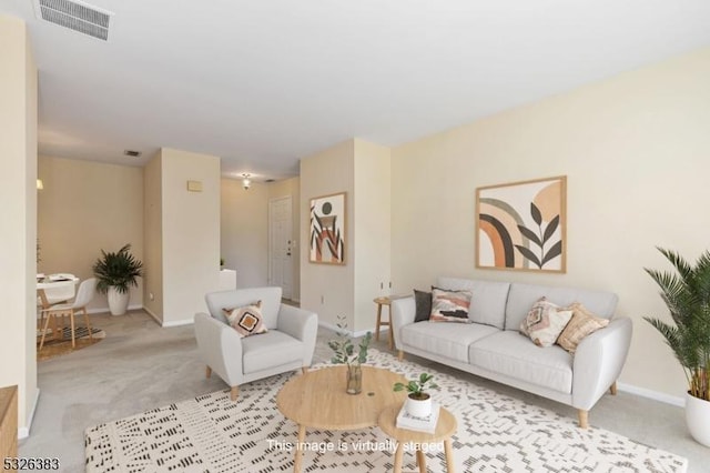 living area with carpet flooring, baseboards, and visible vents