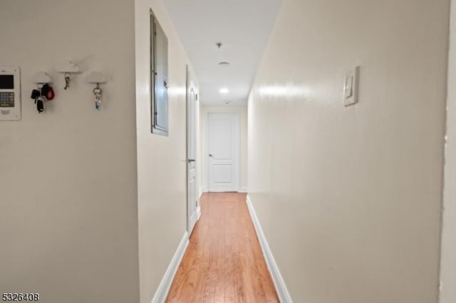 corridor featuring hardwood / wood-style floors