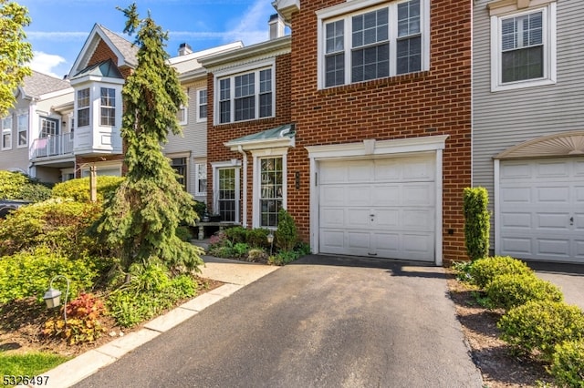 multi unit property featuring a garage