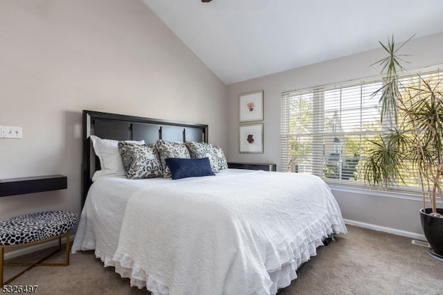 bedroom featuring vaulted ceiling and carpet floors