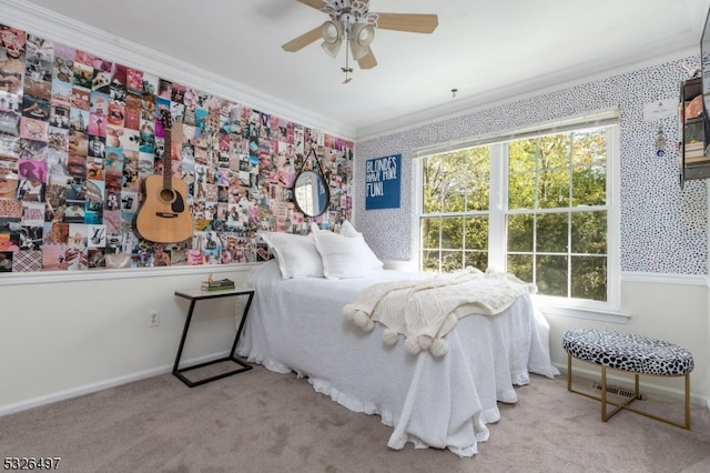 carpeted bedroom featuring multiple windows, ceiling fan, and ornamental molding