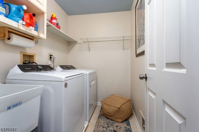 laundry area featuring sink and washer and dryer