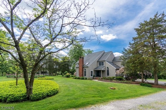 view of side of home featuring a yard