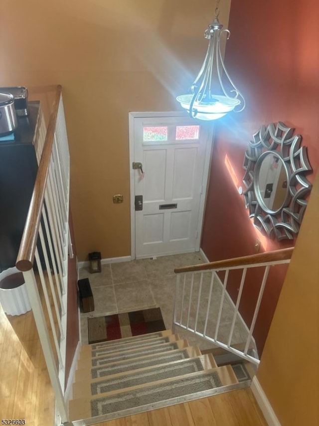 entryway with hardwood / wood-style flooring