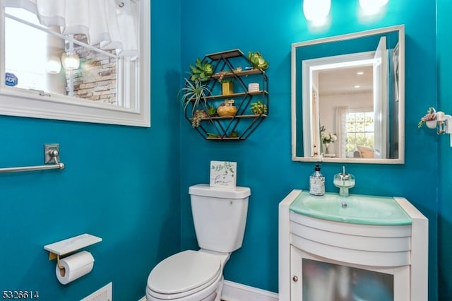 bathroom with vanity and toilet