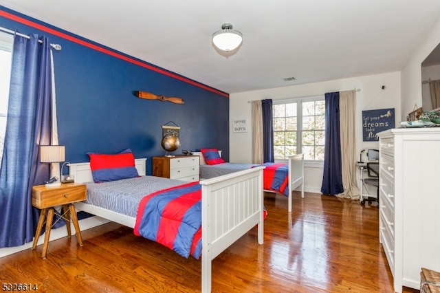 bedroom featuring wood-type flooring