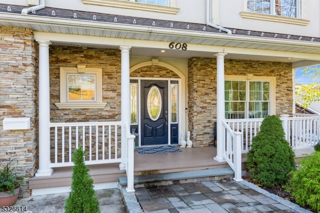 doorway to property with covered porch